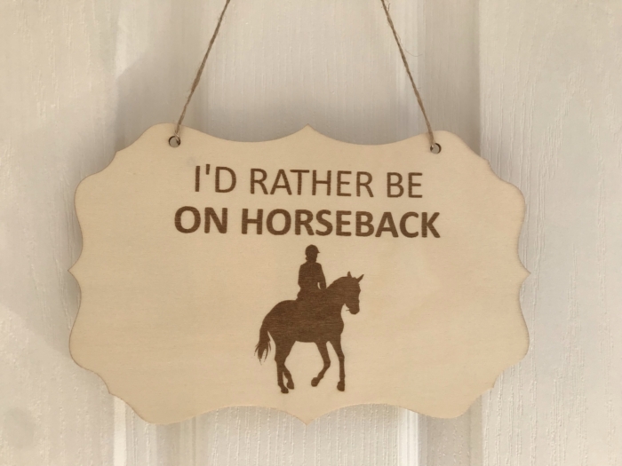 Rather be on horseback shaped sign